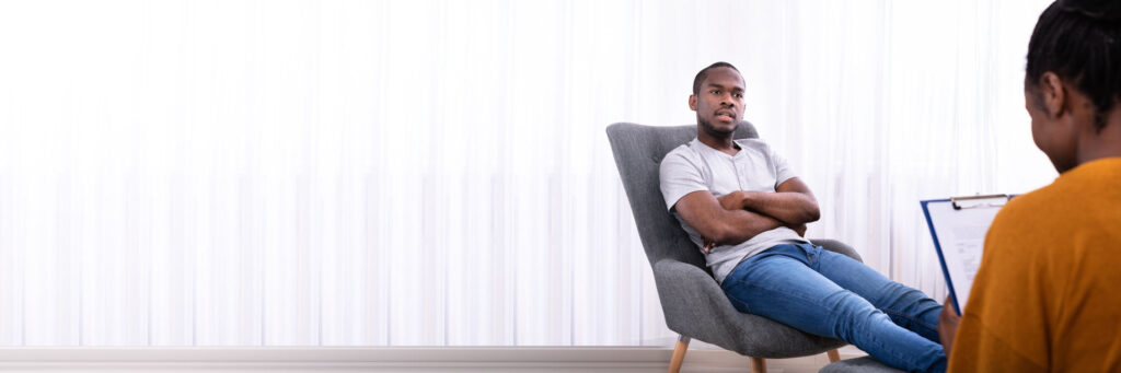 man sitting across from a therapist discussing high-functioning mental illness