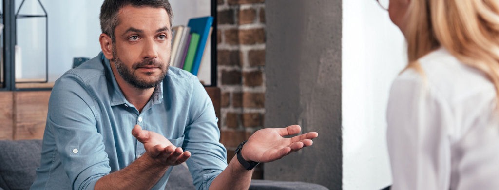 Man asking therapist about the difference between CBT and DBT