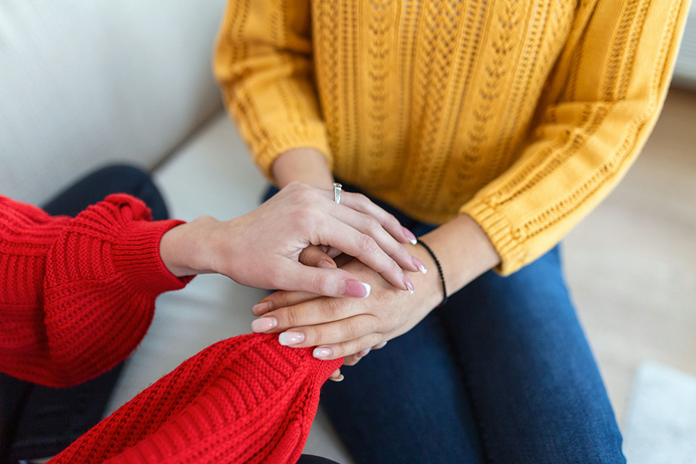 erson offering comfort to a friend experiencing the cycle of depression and addiction.