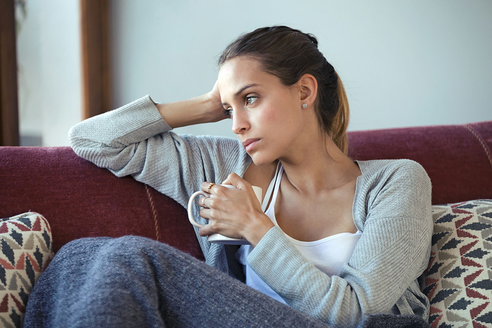 Individual experiencing symptoms of a depressive episode related to bipolar disorder and addiction challenges.