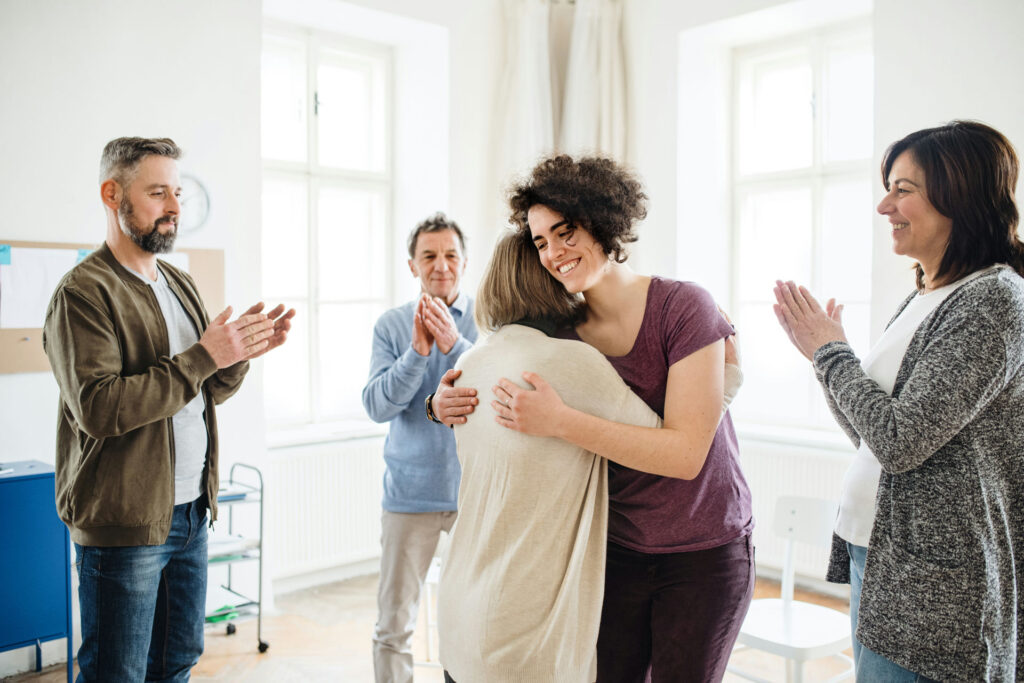 Multigenerational family having an honest conversation about addiction and family history in a supportive home environment.