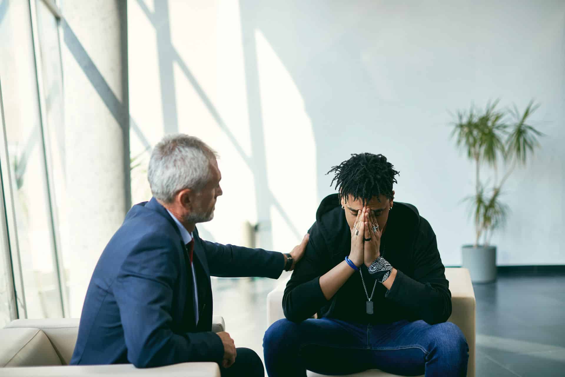 man in therapy for trauma, discussing trauma and substance abuse