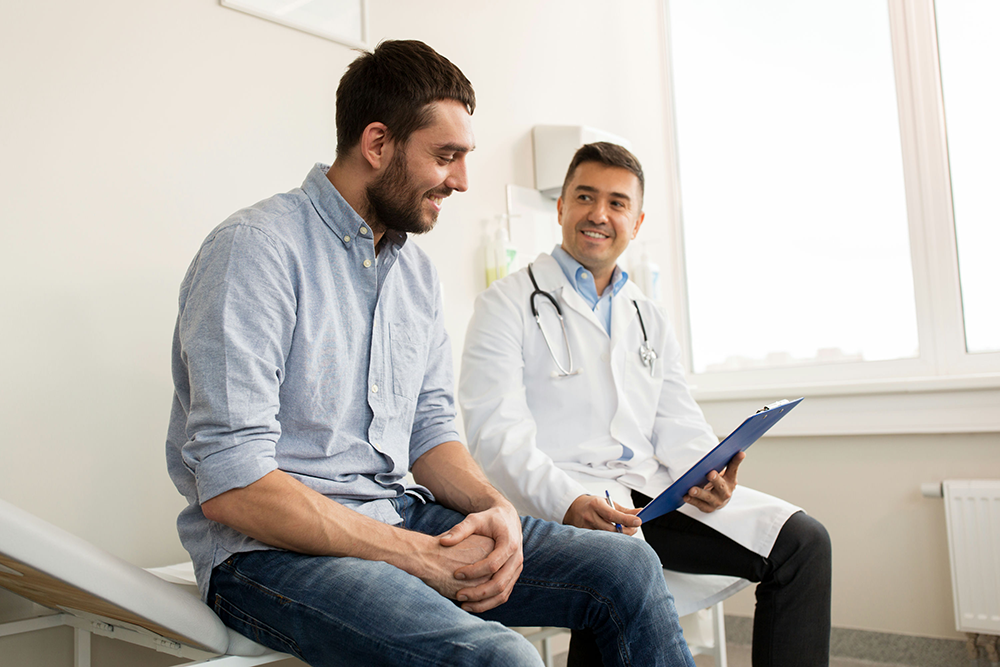 Doctor discussing safe ADHD medication options with a patient in a clinical setting.