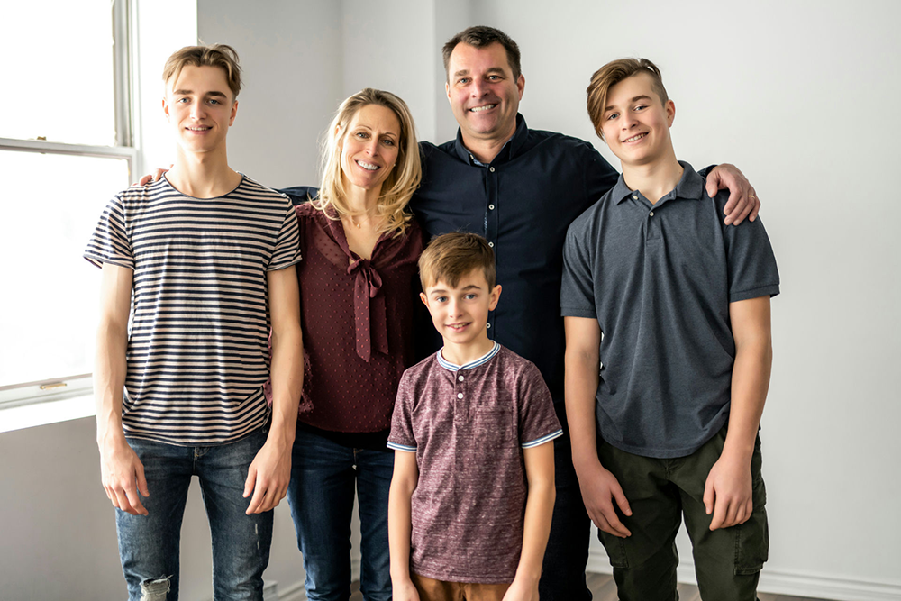 family of five participating in a family therapy program together.