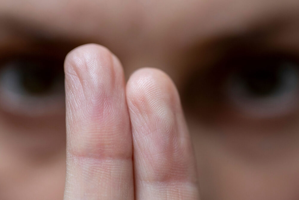 Therapist guiding a client through EMDR therapy using bilateral stimulation in a calm, supportive setting.