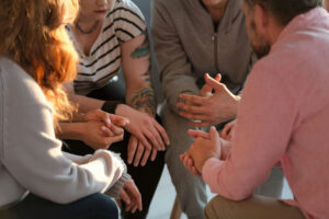 Group therapy session supporting individuals with substance use disorders who may benefit from contingency management.