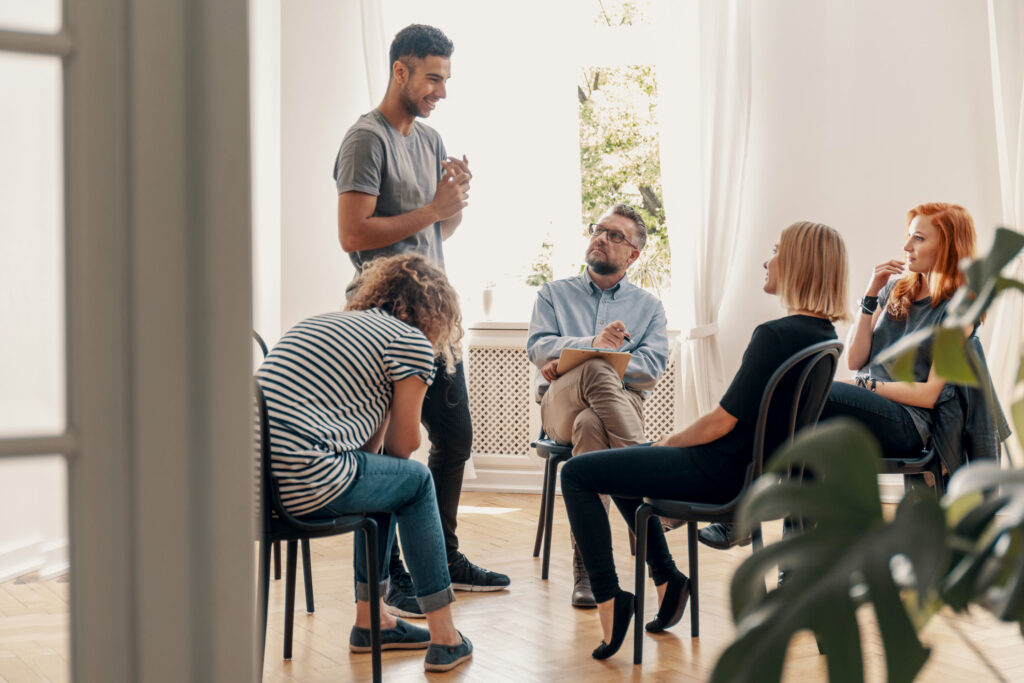 Group therapy session supporting individuals with schizoaffective disorder in outpatient treatment